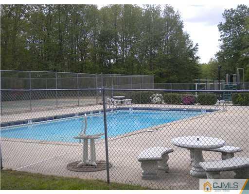 123 Redpine Loop Old Bridge, NJ 08857 - Photo 24 of 24 a view of a swimming pool with a yard