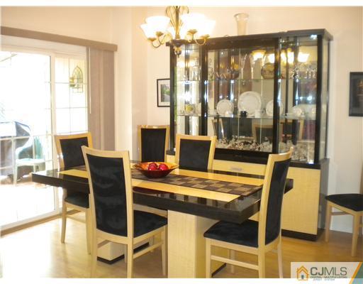 123 Redpine Loop Old Bridge, NJ 08857 - Photo 4 of 24 a view of a dining room with furniture and a chandelier