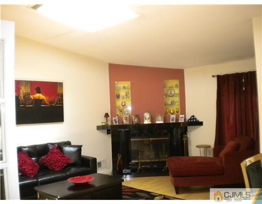 123 Redpine Loop Old Bridge, NJ 08857 - Photo 5 of 24 a living room with furniture and a fireplace