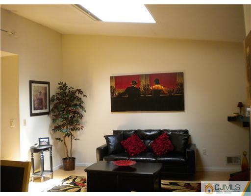 123 Redpine Loop Old Bridge, NJ 08857 - Photo 6 of 24 a living room with furniture and a flat screen tv