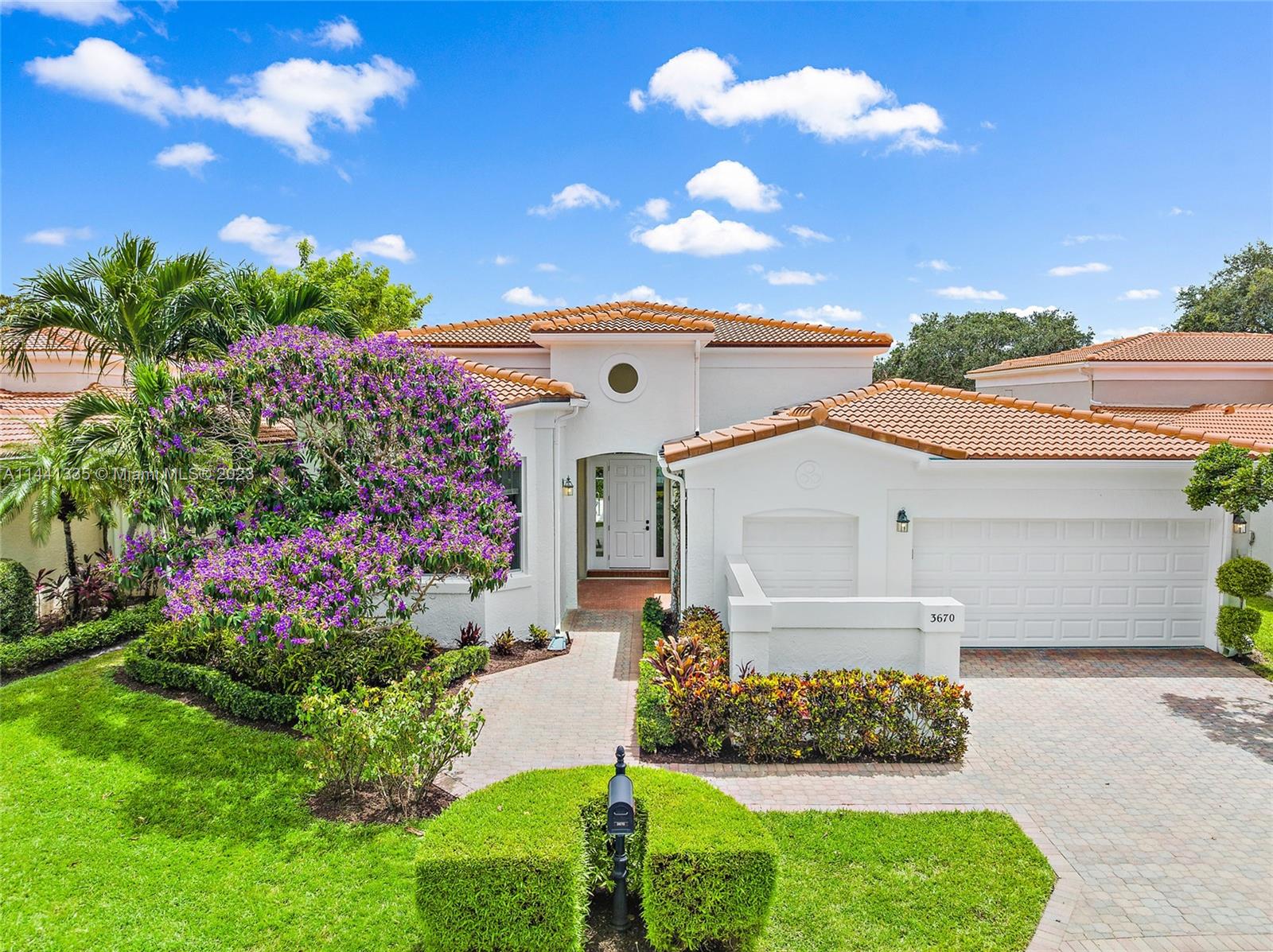 3670 Northwind Court Jupiter, FL 33477 - Photo 1 of 45 a front view of a house with a yard