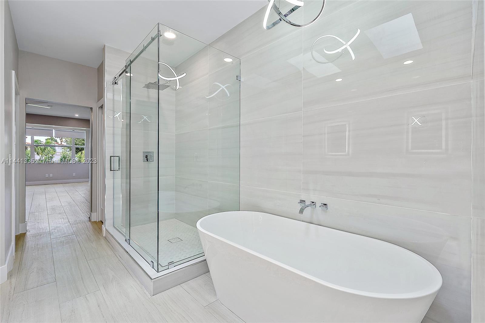 3670 Northwind Court Jupiter, FL 33477 - Photo 17 of 45 a white bath tub sitting next to a shower