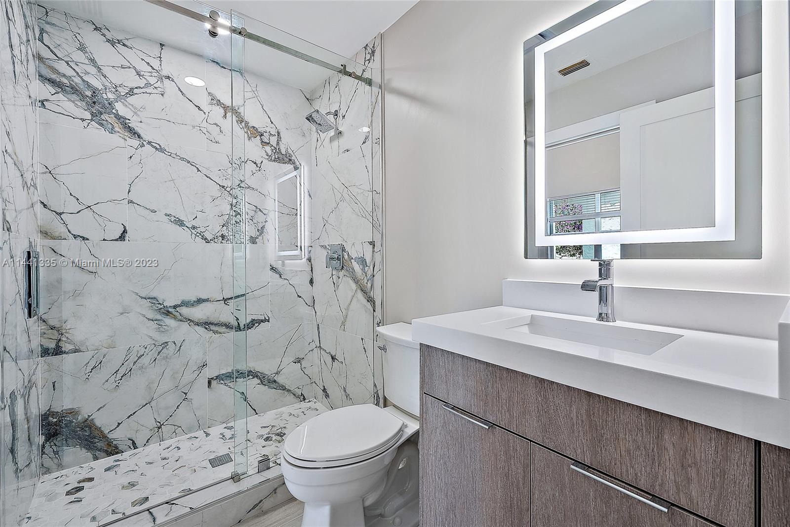 3670 Northwind Court Jupiter, FL 33477 - Photo 22 of 45 a bathroom with a sink toilet and shower