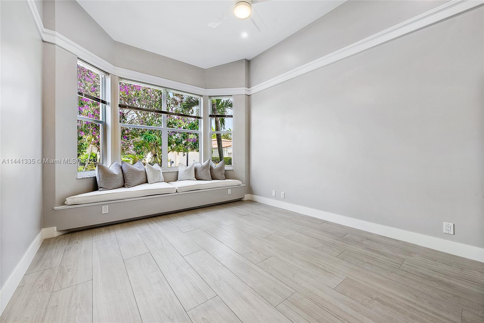 3670 Northwind Court Jupiter, FL 33477 - Photo 23 of 45 a living room with furniture and a large window