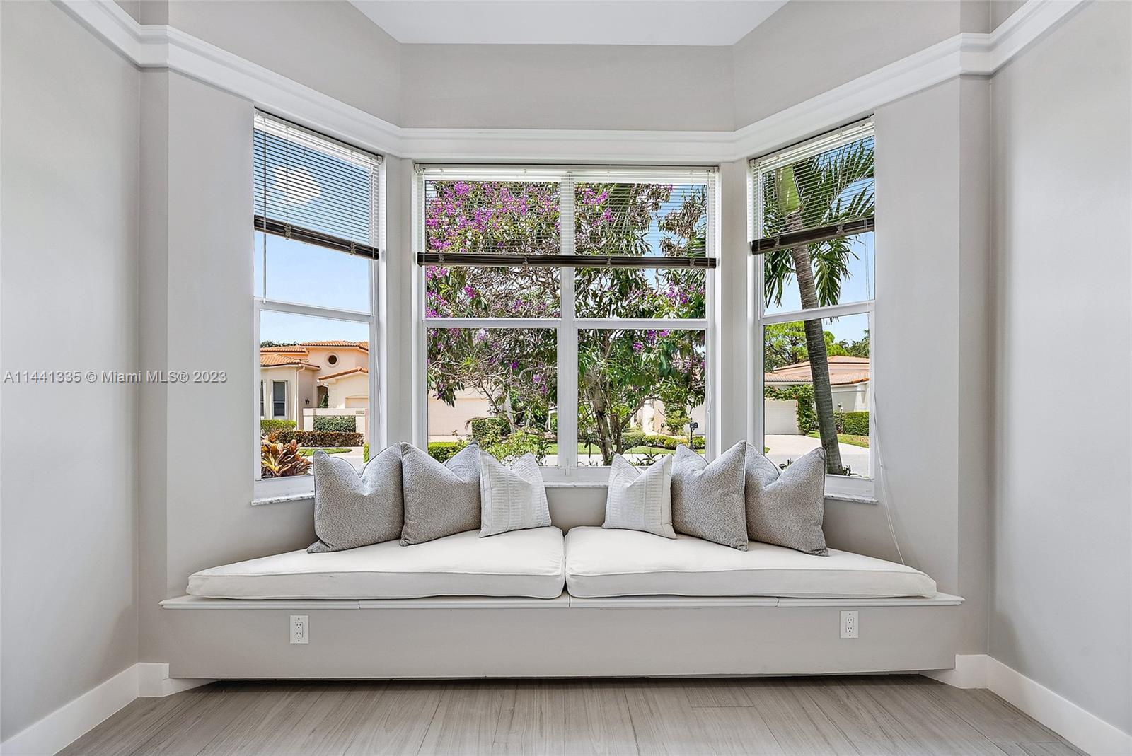3670 Northwind Court Jupiter, FL 33477 - Photo 24 of 45 a living room with furniture and a window