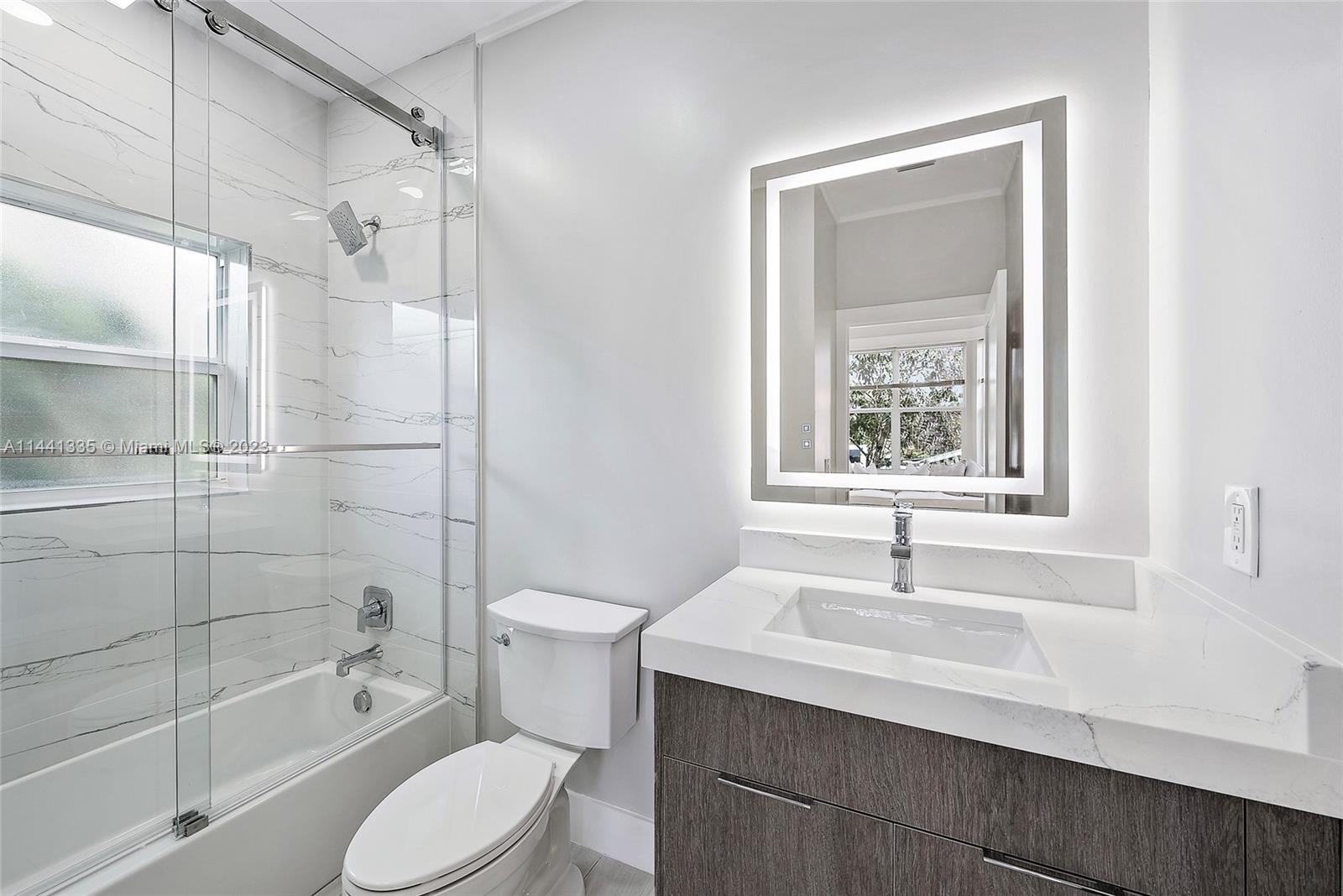 3670 Northwind Court Jupiter, FL 33477 - Photo 25 of 45 a bathroom with a sink toilet and shower