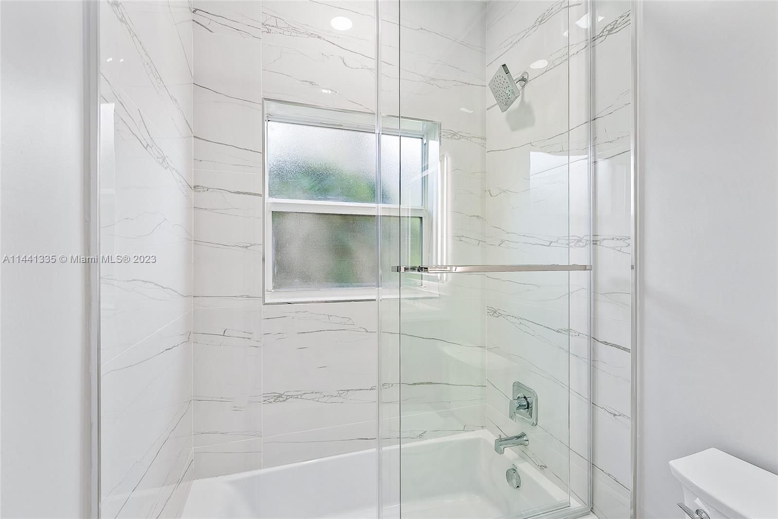 3670 Northwind Court Jupiter, FL 33477 - Photo 26 of 45 a bathroom with a shower