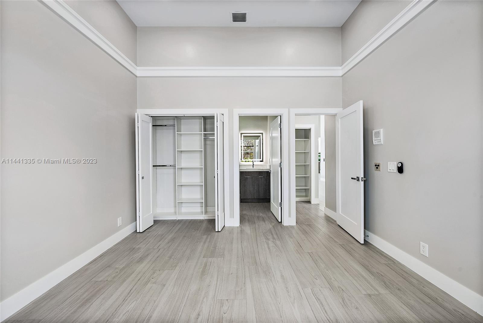 3670 Northwind Court Jupiter, FL 33477 - Photo 27 of 45 wooden floor in an empty room