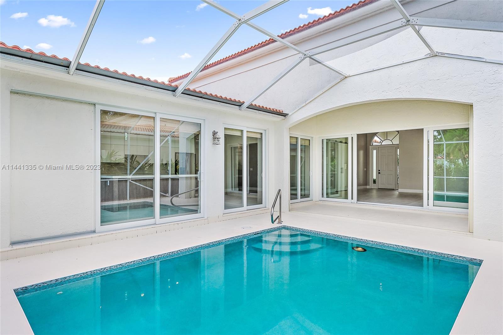 3670 Northwind Court Jupiter, FL 33477 - Photo 30 of 45 a swimming pool with outdoor seating and yard