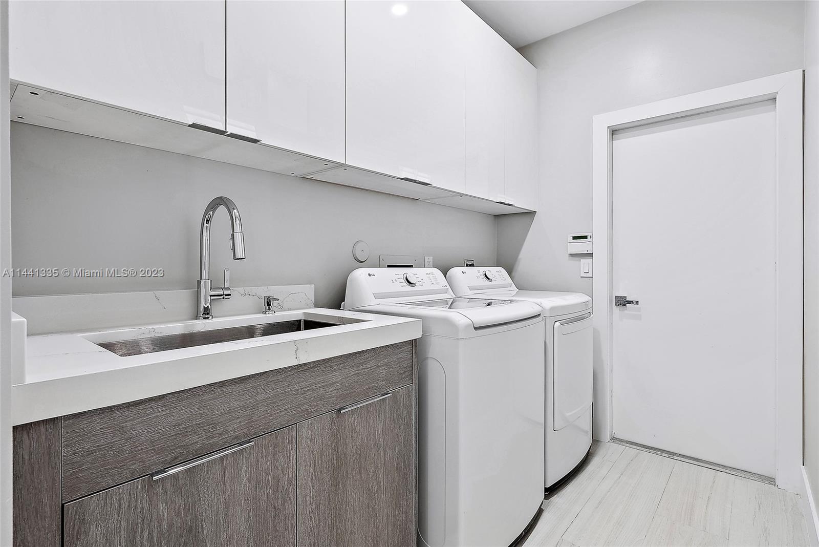 3670 Northwind Court Jupiter, FL 33477 - Photo 31 of 45 a utility room with dryer and washer