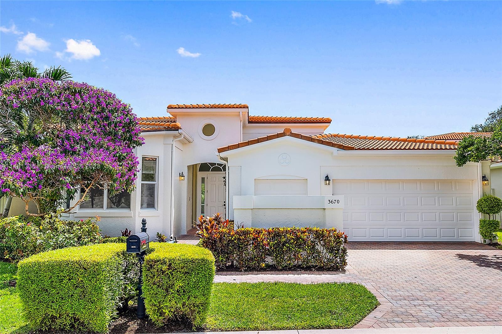 3670 Northwind Court Jupiter, FL 33477 - Photo 35 of 45 a front view of a house with a yard