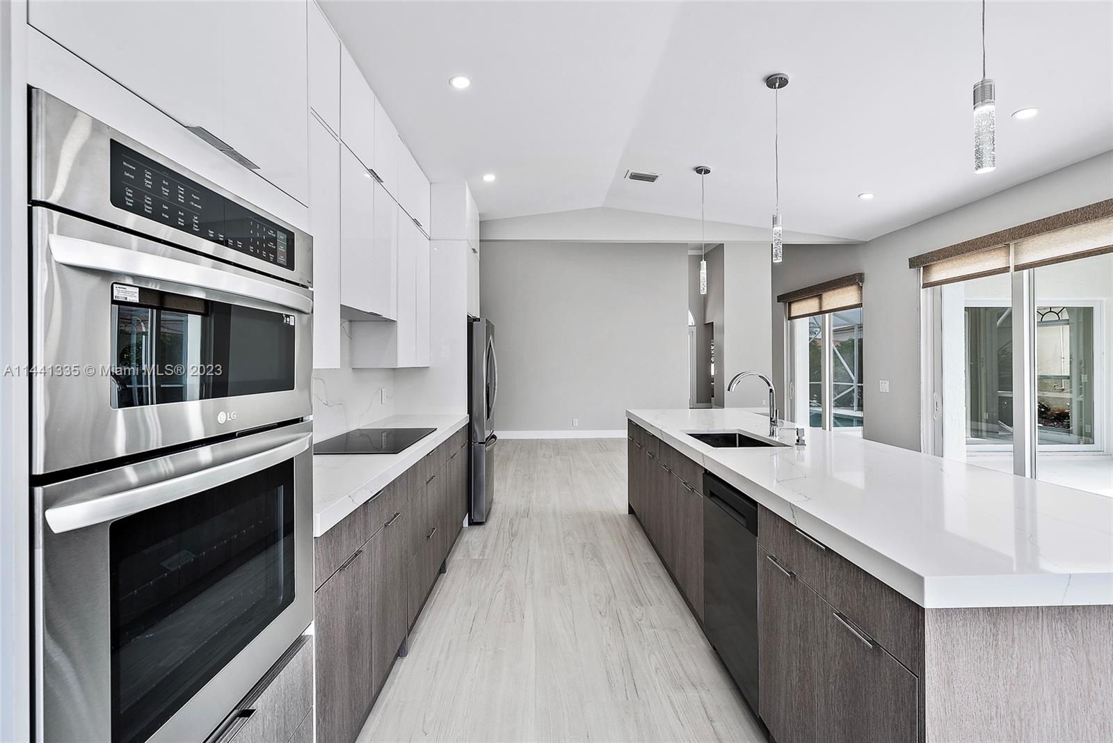 3670 Northwind Court Jupiter, FL 33477 - Photo 9 of 45 a large kitchen with stainless steel appliances