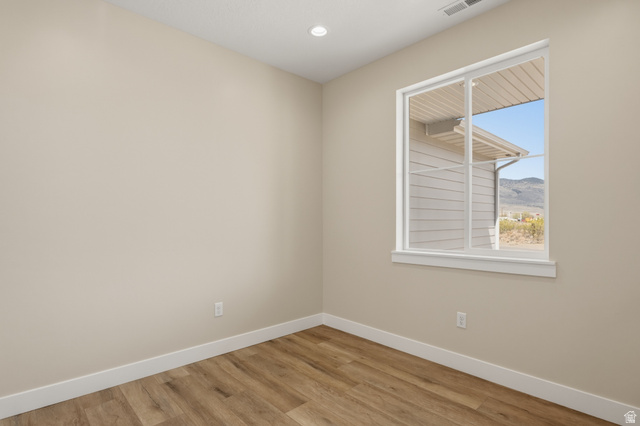 157 West 100 South Joseph, UT 84739 - Photo 7 of 30 Unfurnished room featuring light wood-type flooring, recessed lighting, and a mountain view