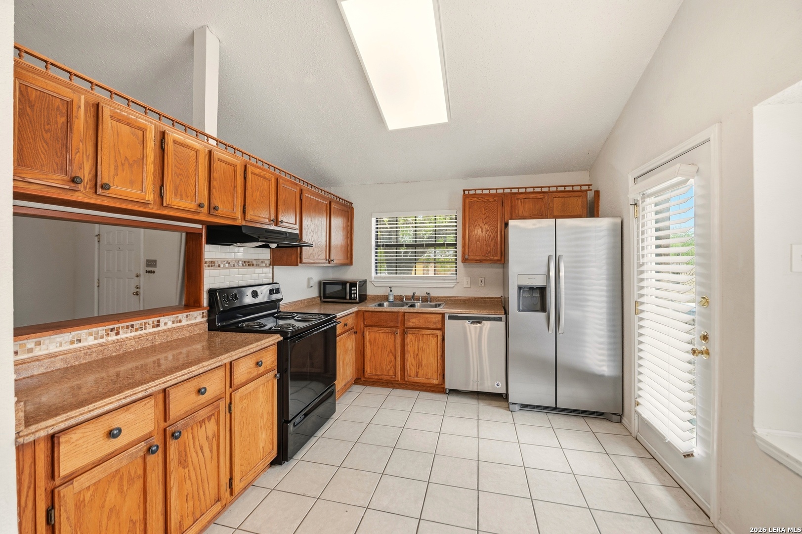 3425 Country View Cibolo, TX 78108 - Photo 11 of 39 a kitchen with stainless steel appliances granite countertop a refrigerator and a stove top oven