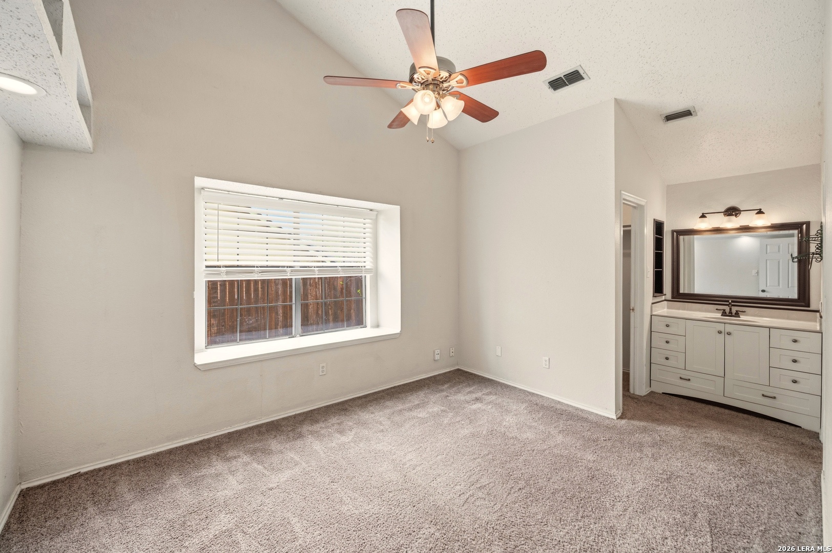 3425 Country View Cibolo, TX 78108 - Photo 12 of 39 a view of a kitchen with a flat screen tv ceiling fan and window