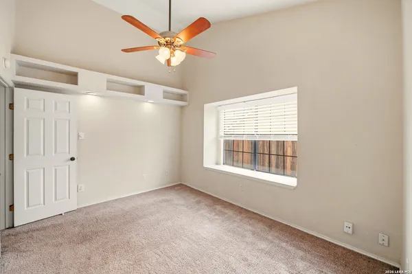 a view of an empty room with a window