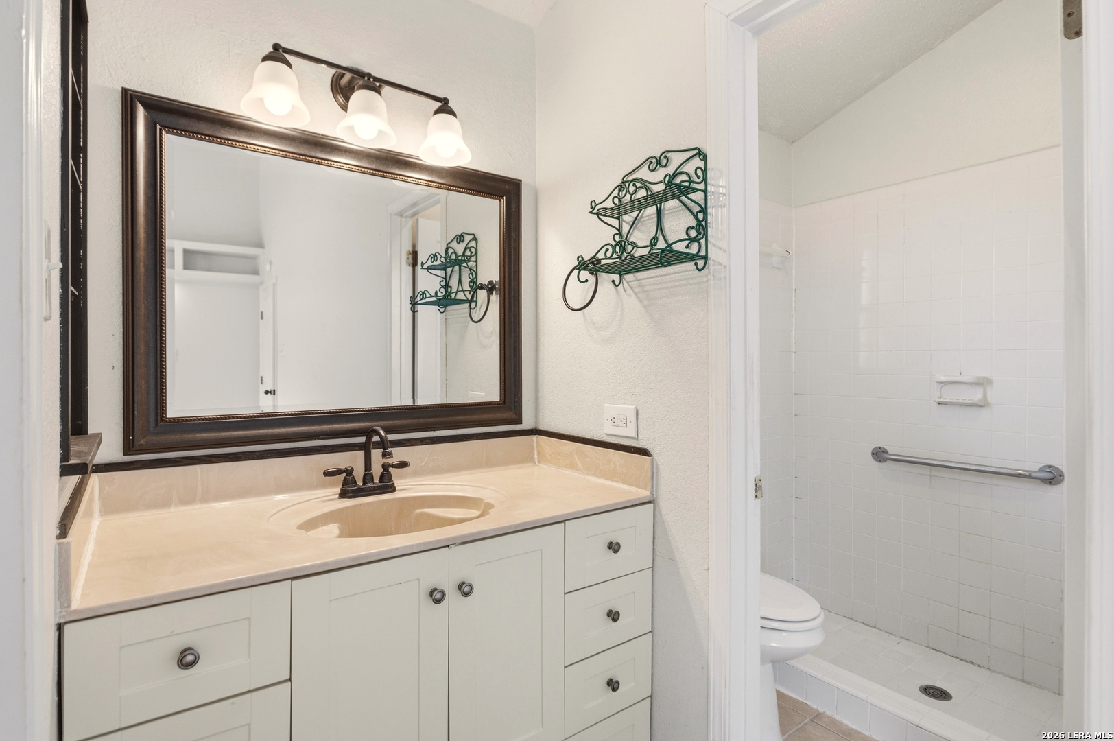 3425 Country View Cibolo, TX 78108 - Photo 16 of 39 a bathroom with a sink a toilet and shower