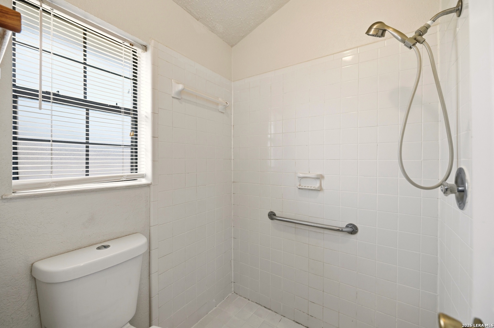 3425 Country View Cibolo, TX 78108 - Photo 17 of 39 a bathroom with a shower a toilet and a window