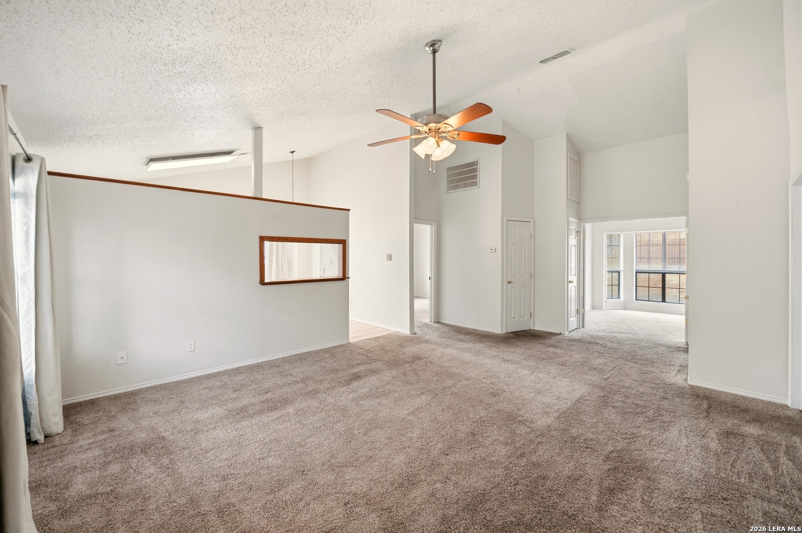 3425 Country View Cibolo, TX 78108 - Photo 3 of 39 an empty room with windows and ceiling fan