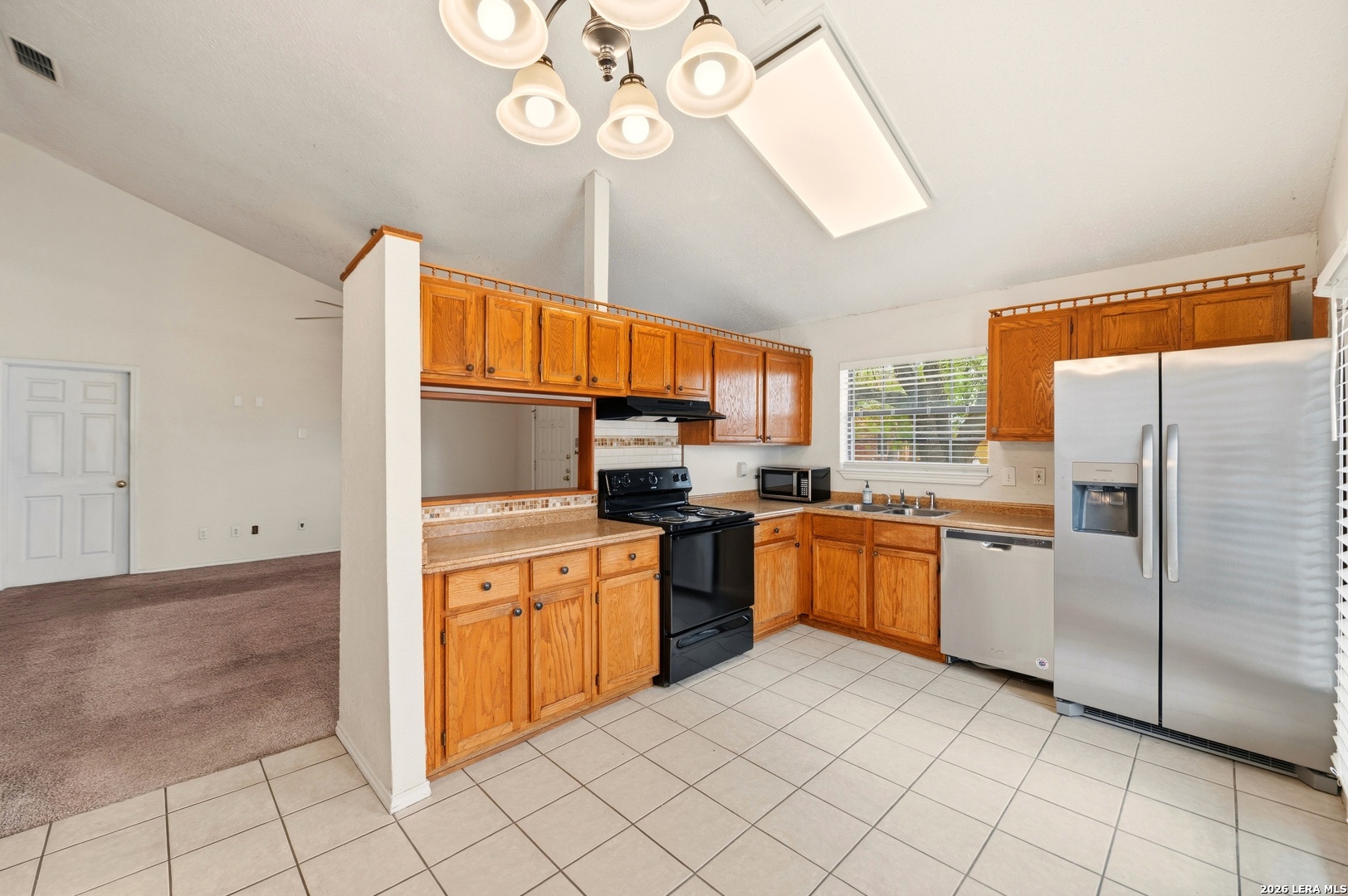 3425 Country View Cibolo, TX 78108 - Photo 8 of 39 a kitchen with stainless steel appliances granite countertop a sink and cabinets