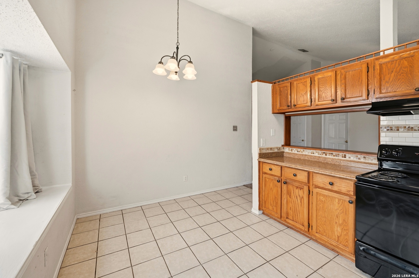 3425 Country View Cibolo, TX 78108 - Photo 9 of 39 a kitchen with stainless steel appliances granite countertop a stove a sink and a refrigerator