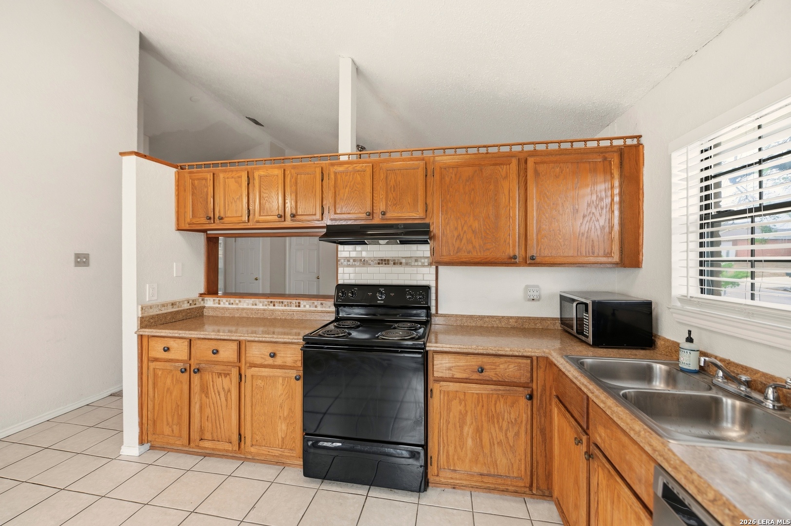 3425 Country View Cibolo, TX 78108 - Photo 10 of 39 a kitchen with a sink stove and cabinets
