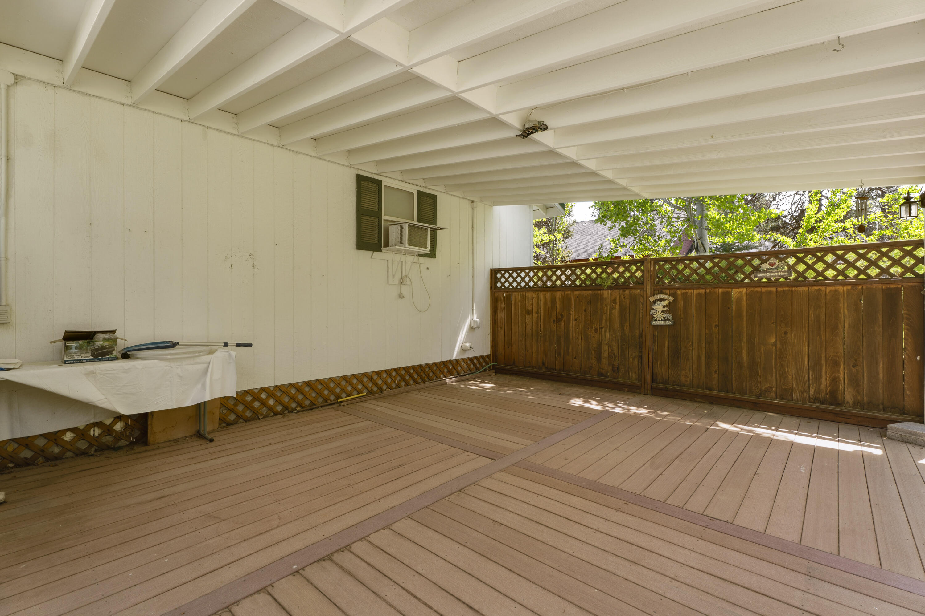 55885 Osprey Road Bend, OR 97707 - Photo 40 of 58 Back Porch with privacy fencing