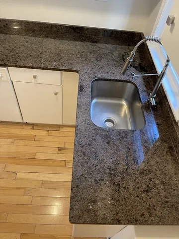 a bathroom with a sink and mirror