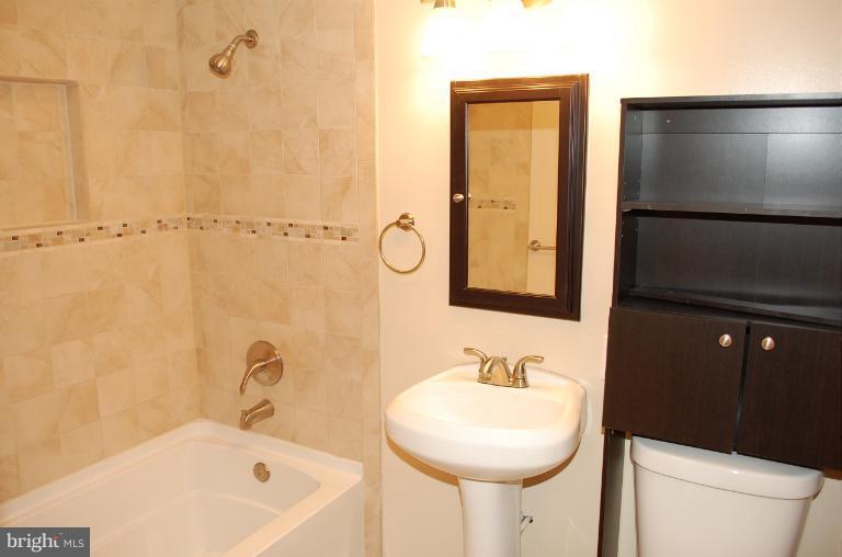 6216 Stevens Forest Road Columbia, MD 21045 - Photo 14 of 30 a bathroom with a sink and a mirror
