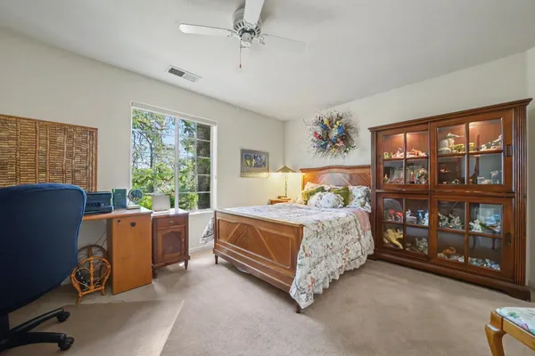a view of a chair and table in the garden