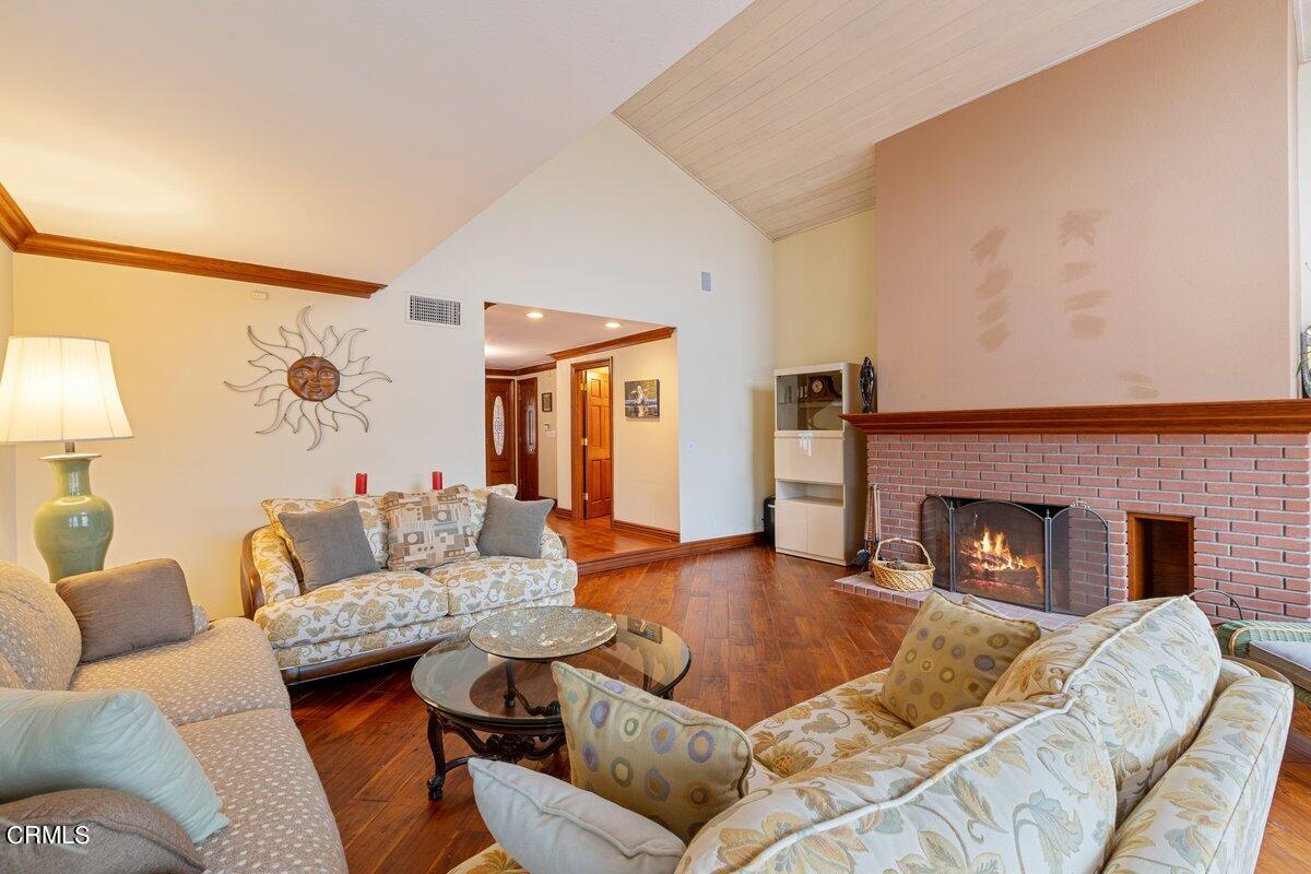 2131 Ravoli Drive Oxnard, CA 93035 - Photo 12 of 43 a living room with furniture and a fireplace