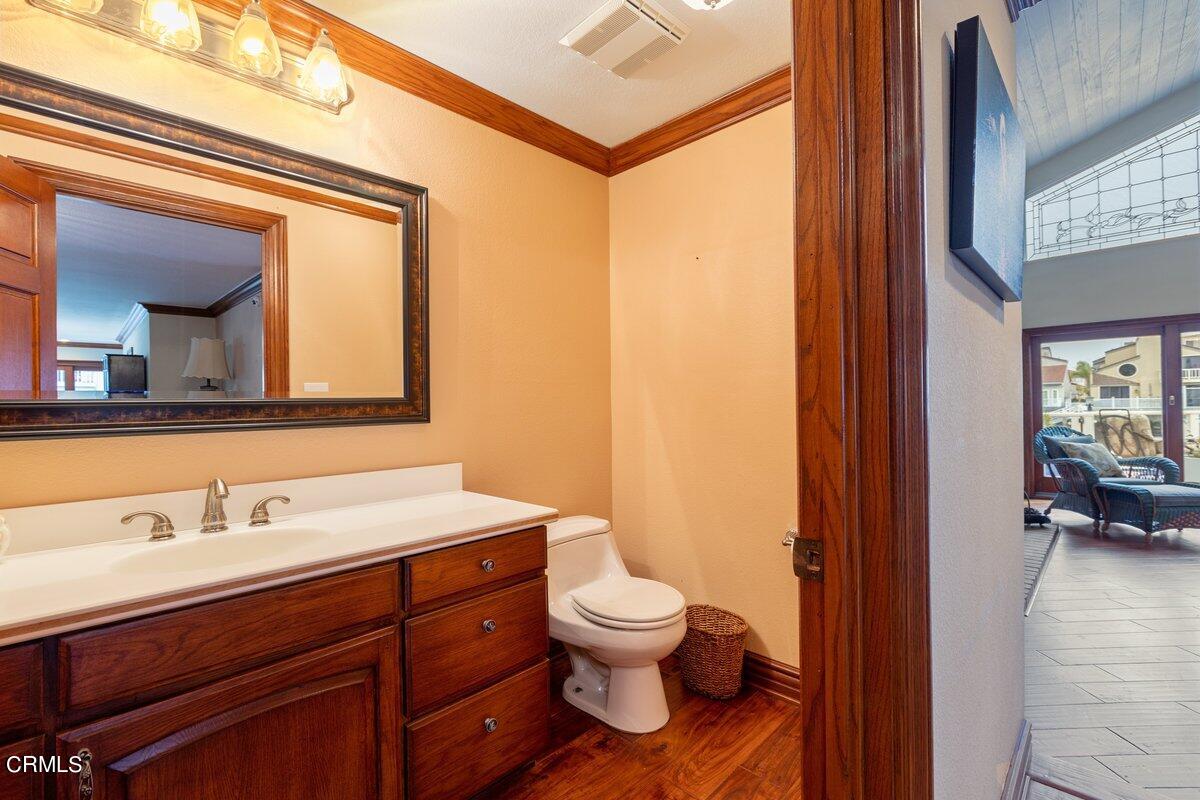 2131 Ravoli Drive Oxnard, CA 93035 - Photo 13 of 43 a bathroom with a toilet sink and mirror