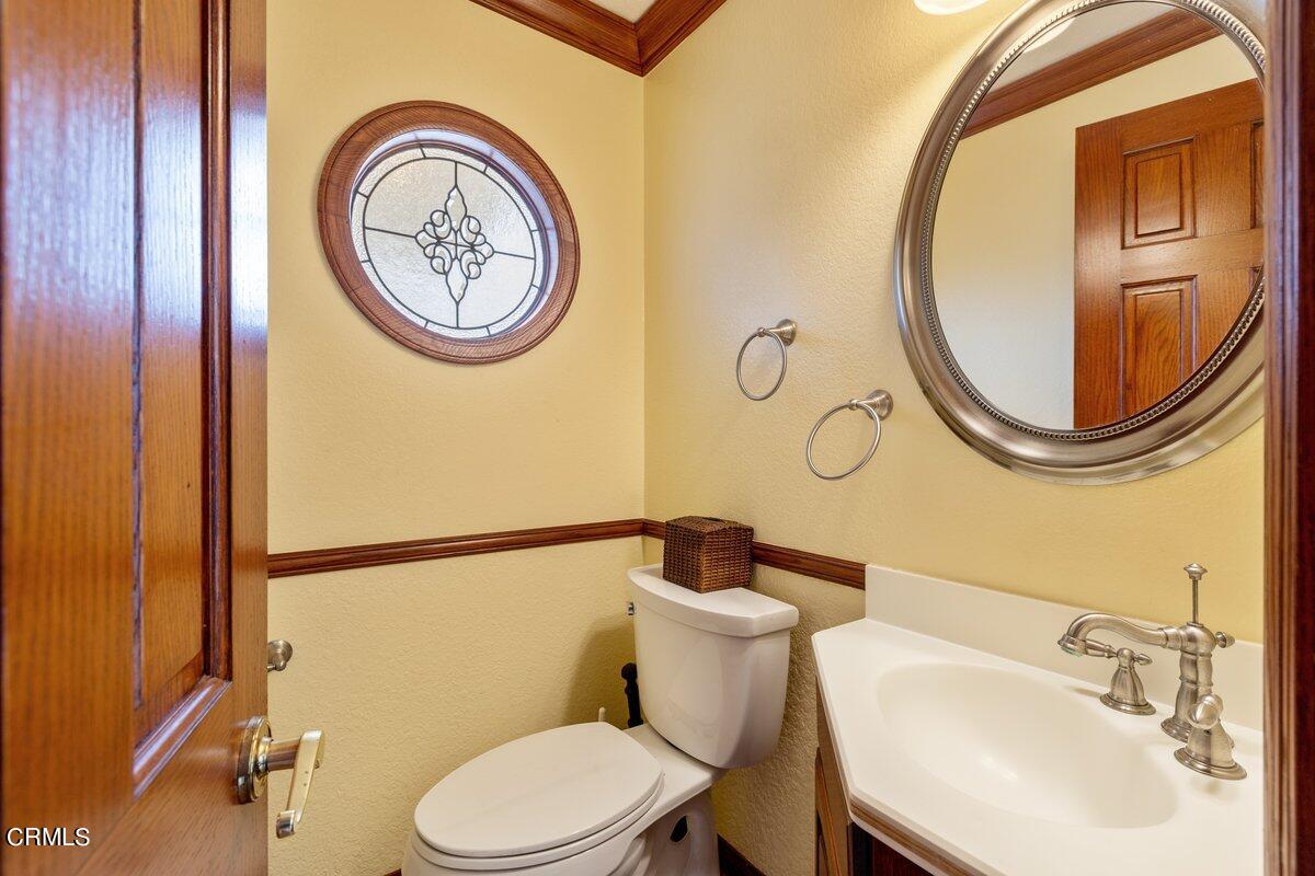 2131 Ravoli Drive Oxnard, CA 93035 - Photo 18 of 43 a bathroom with a toilet and a sink