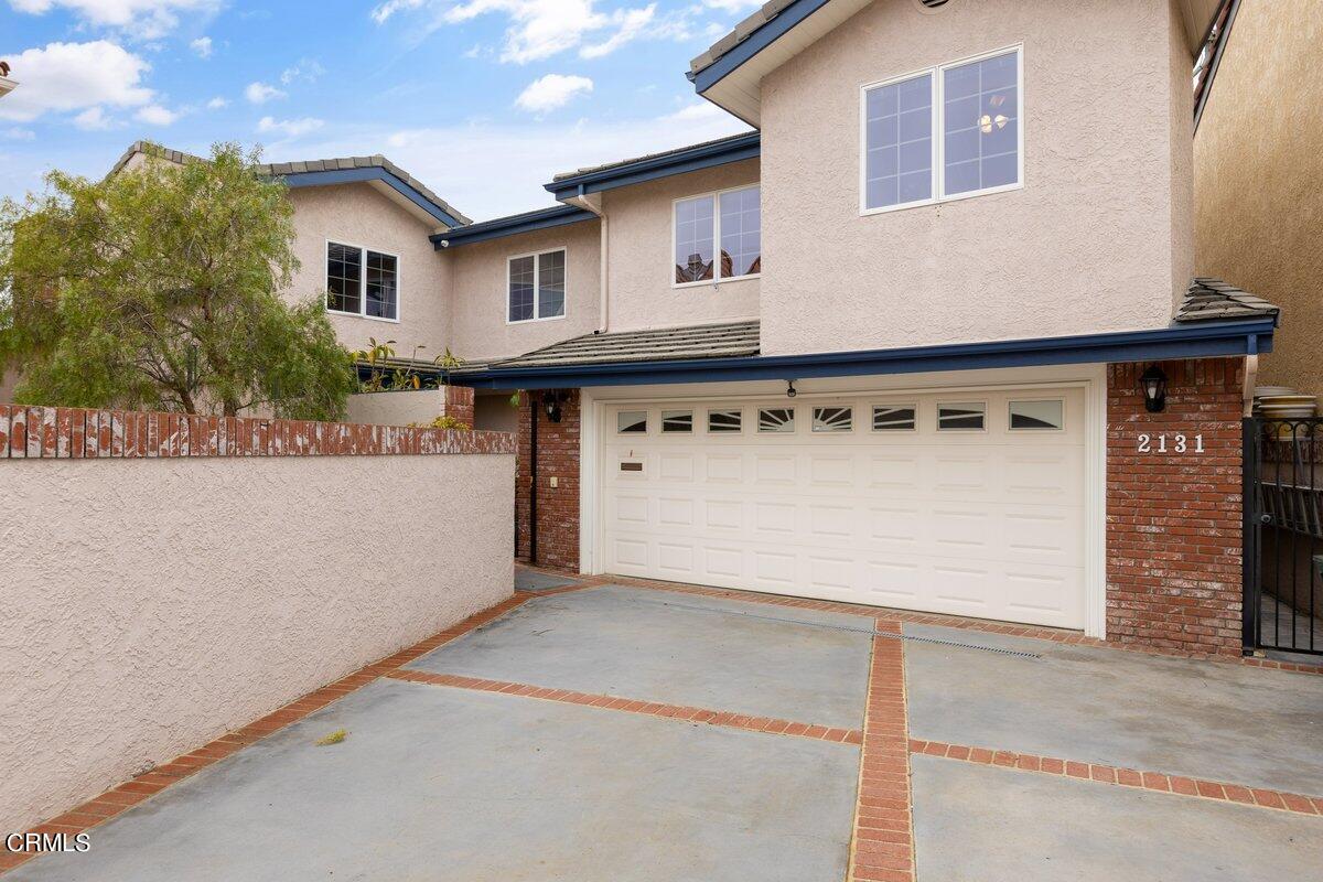2131 Ravoli Drive Oxnard, CA 93035 - Photo 2 of 43 a view of a house with a garage