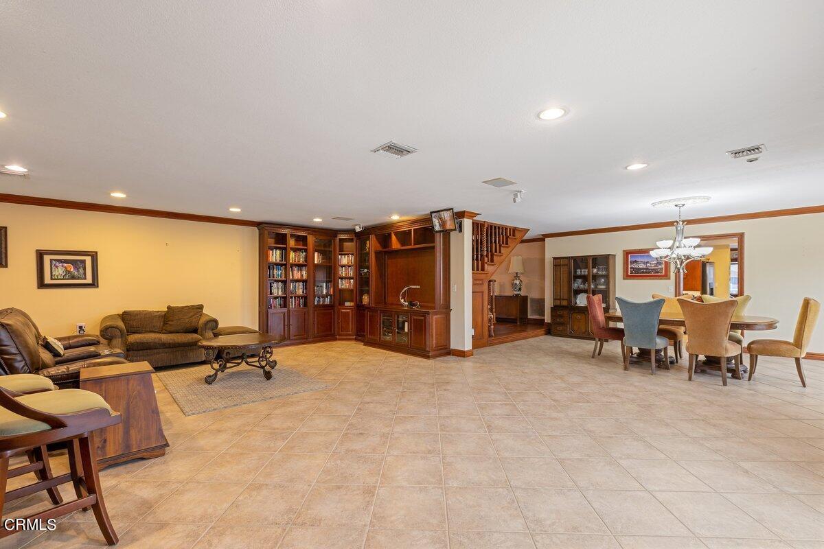 2131 Ravoli Drive Oxnard, CA 93035 - Photo 22 of 43 a living room with furniture and a flat screen tv