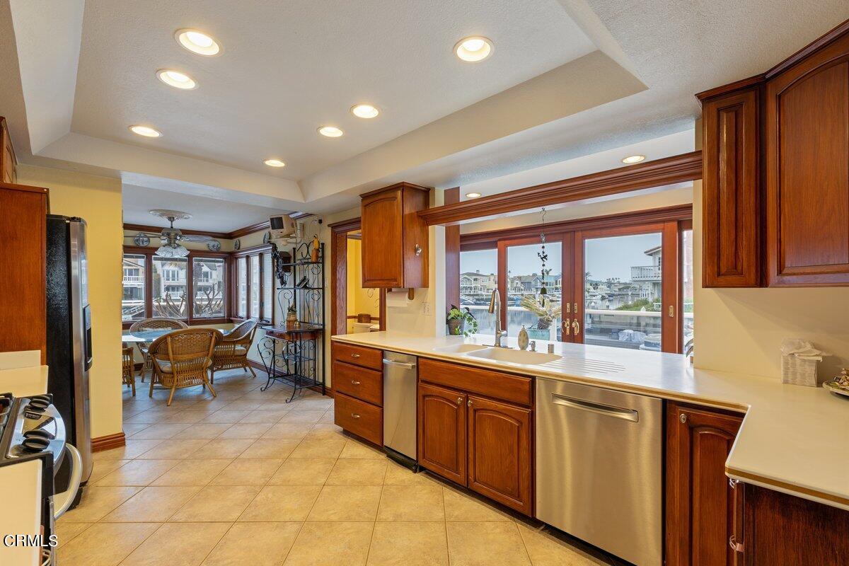 2131 Ravoli Drive Oxnard, CA 93035 - Photo 23 of 43 a large white kitchen with a large window