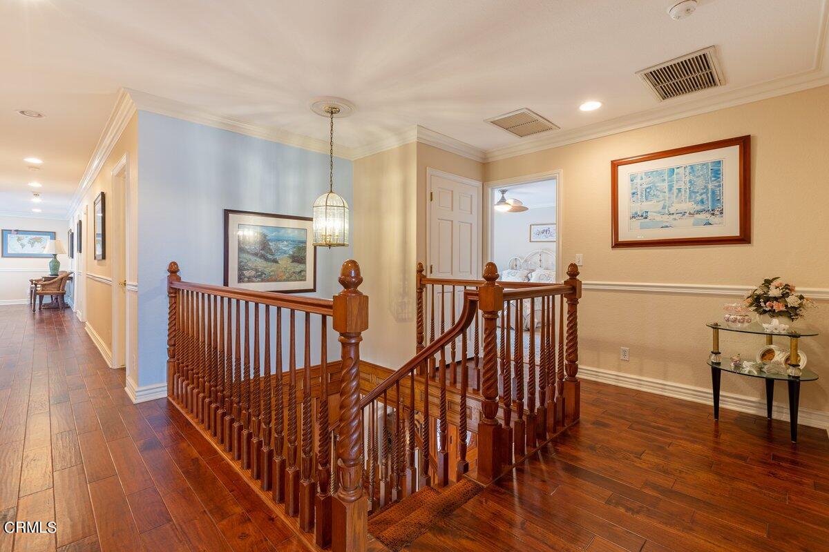2131 Ravoli Drive Oxnard, CA 93035 - Photo 24 of 43 a view of a hallway with wooden floor and windows