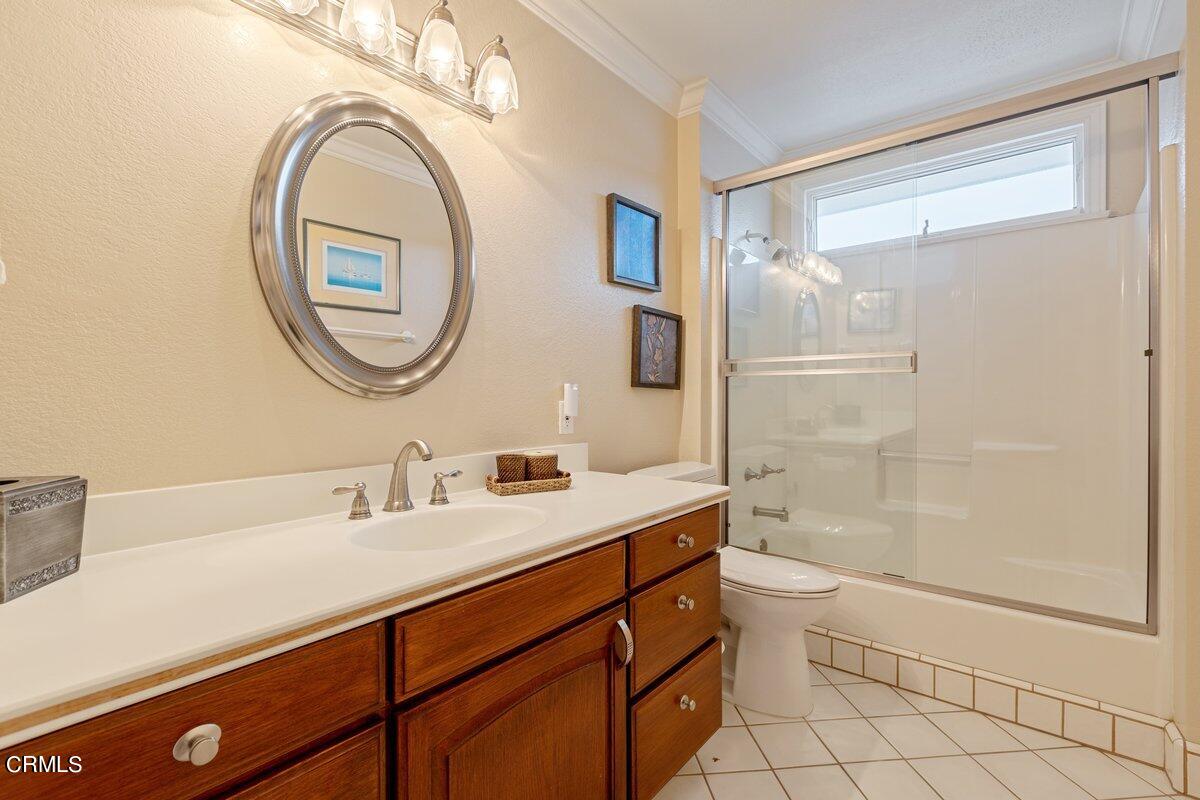 2131 Ravoli Drive Oxnard, CA 93035 - Photo 29 of 43 a bathroom with a sink a toilet and a mirror