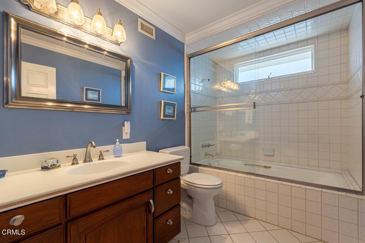 2131 Ravoli Drive Oxnard, CA 93035 - Photo 32 of 43 a bathroom with a sink a toilet and shower