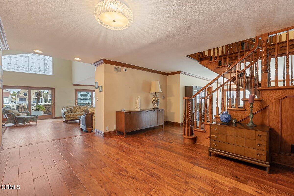 2131 Ravoli Drive Oxnard, CA 93035 - Photo 9 of 43 a view of a living room and entryway with wooden floor