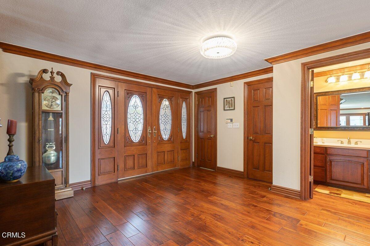2131 Ravoli Drive Oxnard, CA 93035 - Photo 10 of 43 a view of empty room with wooden floor and fan