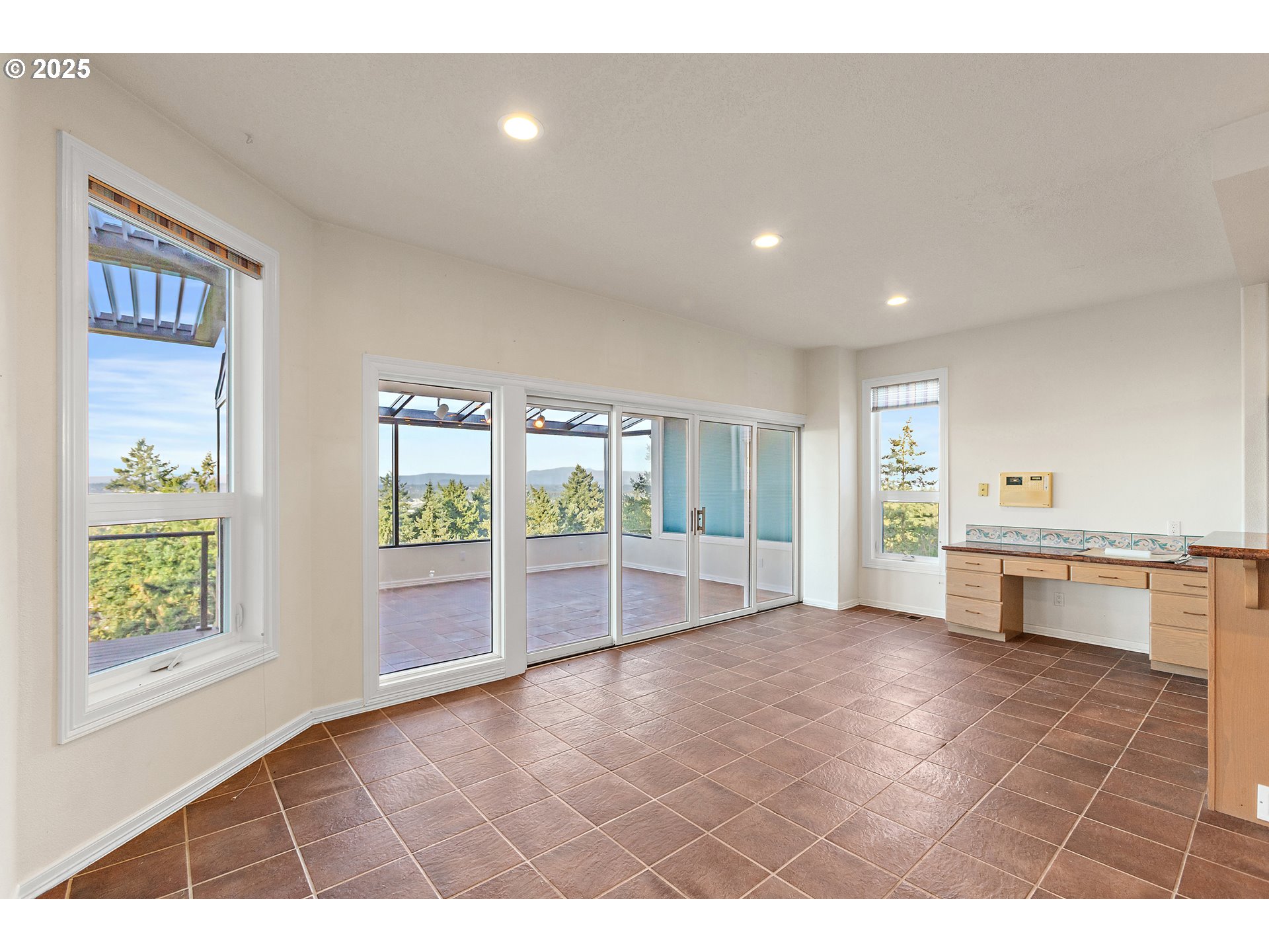 9101 Northeast Cliff Street Portland, OR 97220 - Photo 13 of 26 a view of an empty room with a window