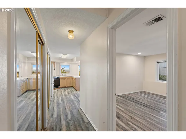 a view of a bedroom from a hallway