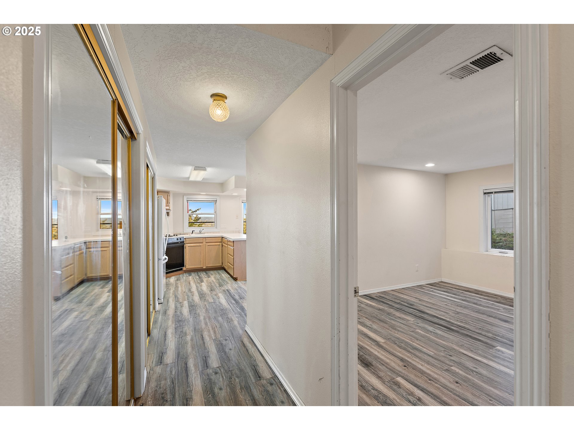 9101 Northeast Cliff Street Portland, OR 97220 - Photo 17 of 26 a view of a bedroom from a hallway