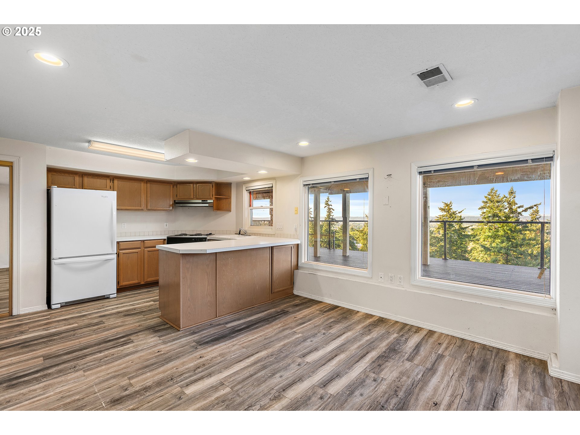 9101 Northeast Cliff Street Portland, OR 97220 - Photo 20 of 26 a kitchen with a wooden floor and window
