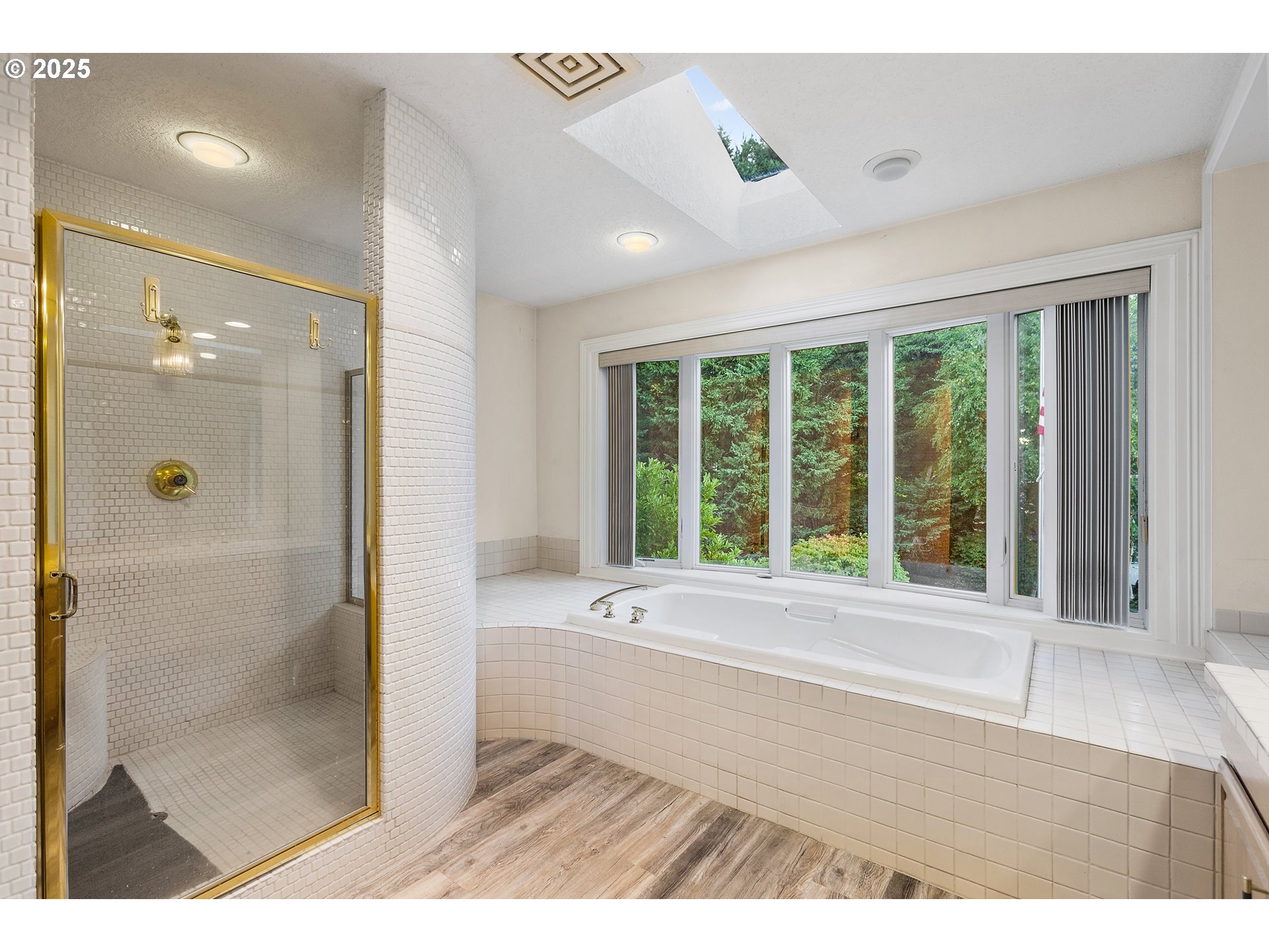 9101 Northeast Cliff Street Portland, OR 97220 - Photo 24 of 26 a bathroom with a bathtub and a shower