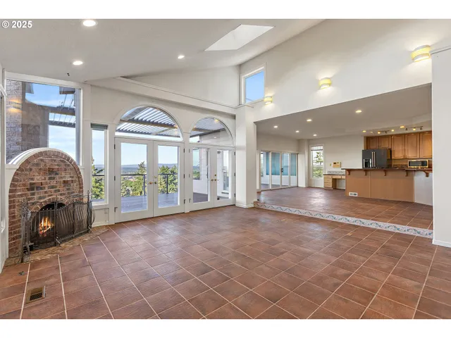 a view of livingroom with furniture wooden floor and a large window