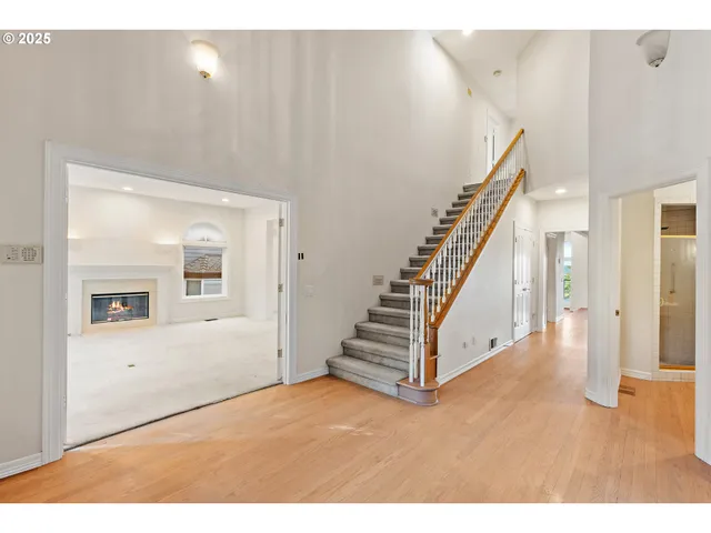 a view of an entryway with wooden floor