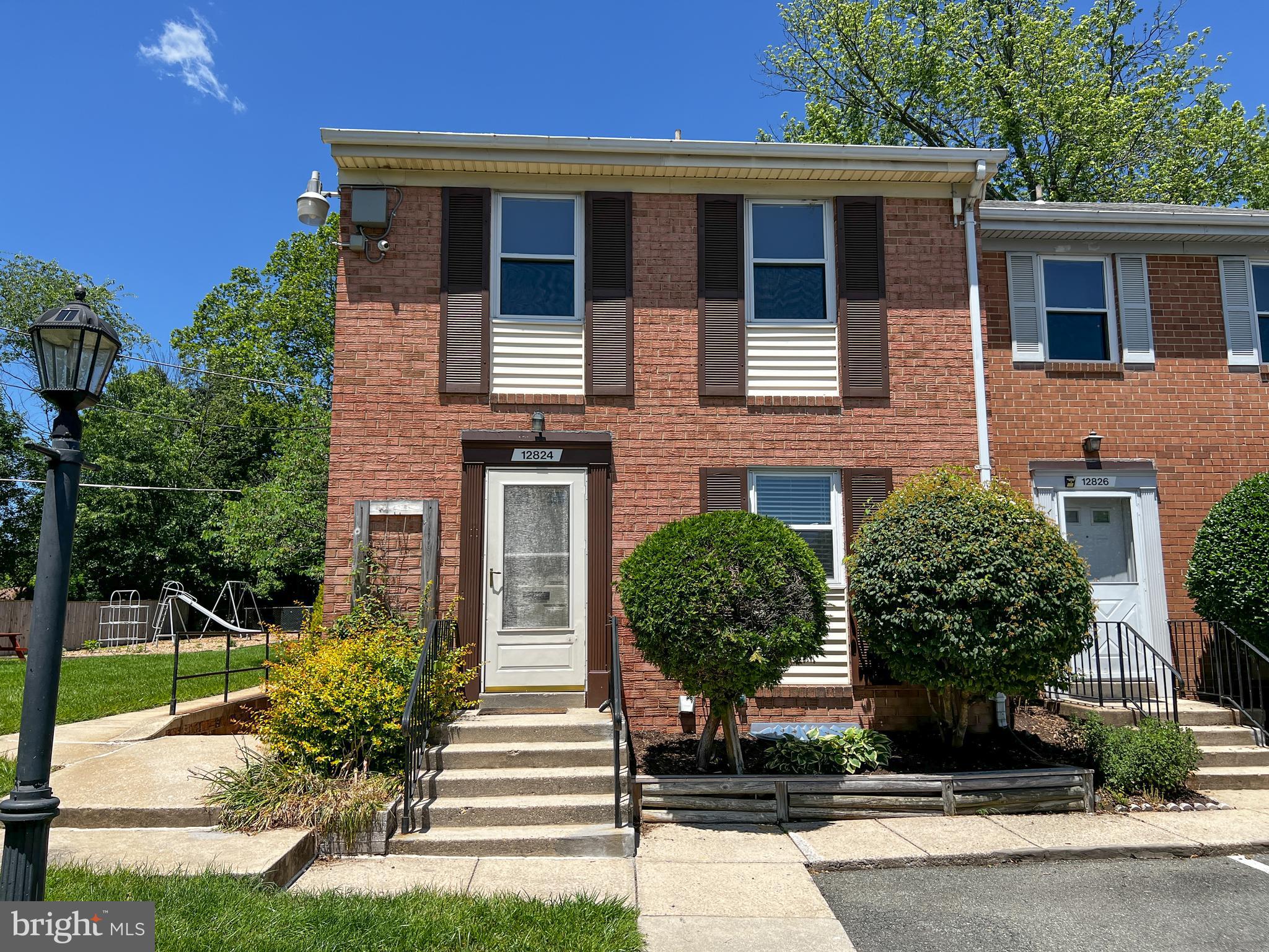 12824 Epping Terrace Silver Spring, MD 20906 - Photo 1 of 23 a front view of a house with garden