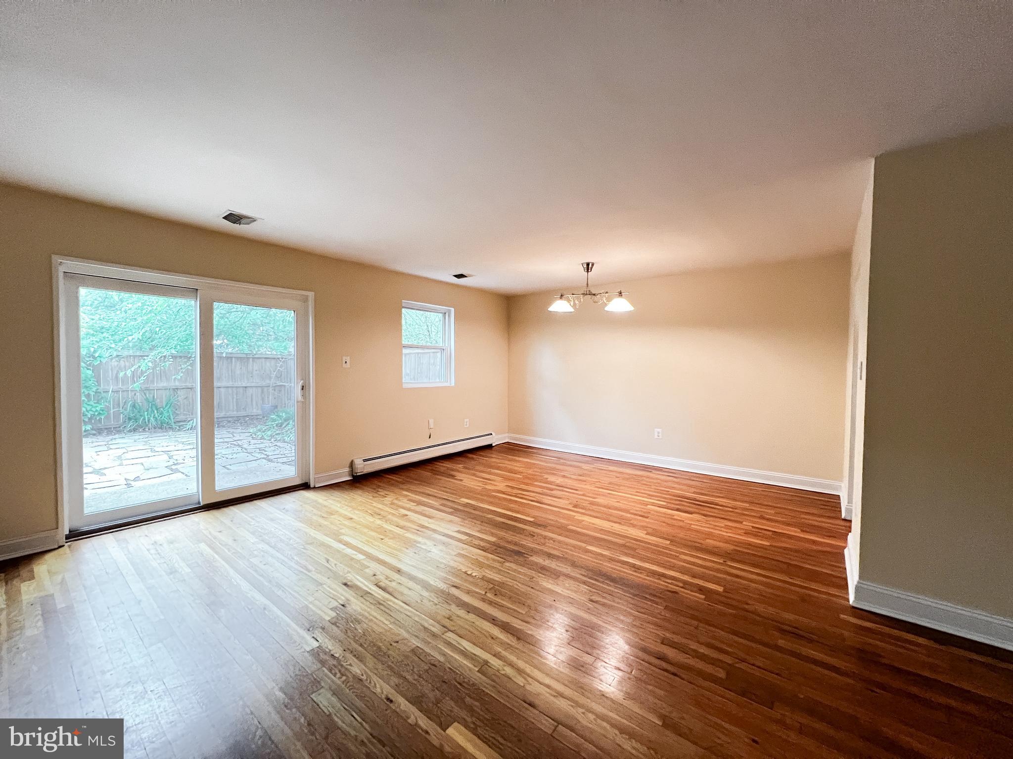 12824 Epping Terrace Silver Spring, MD 20906 - Photo 12 of 23 a view of empty room with wooden floor and fan